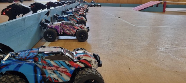 RC cars lined up at the starting line.